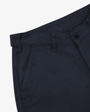 Front close up view of Uskees dark blue drill work pants for men  showing pocket, waistband and belt loop detail - on a white background