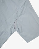 Front close up view of an Uskees light blue short-sleeve shirt showing the underarm mesh vent.