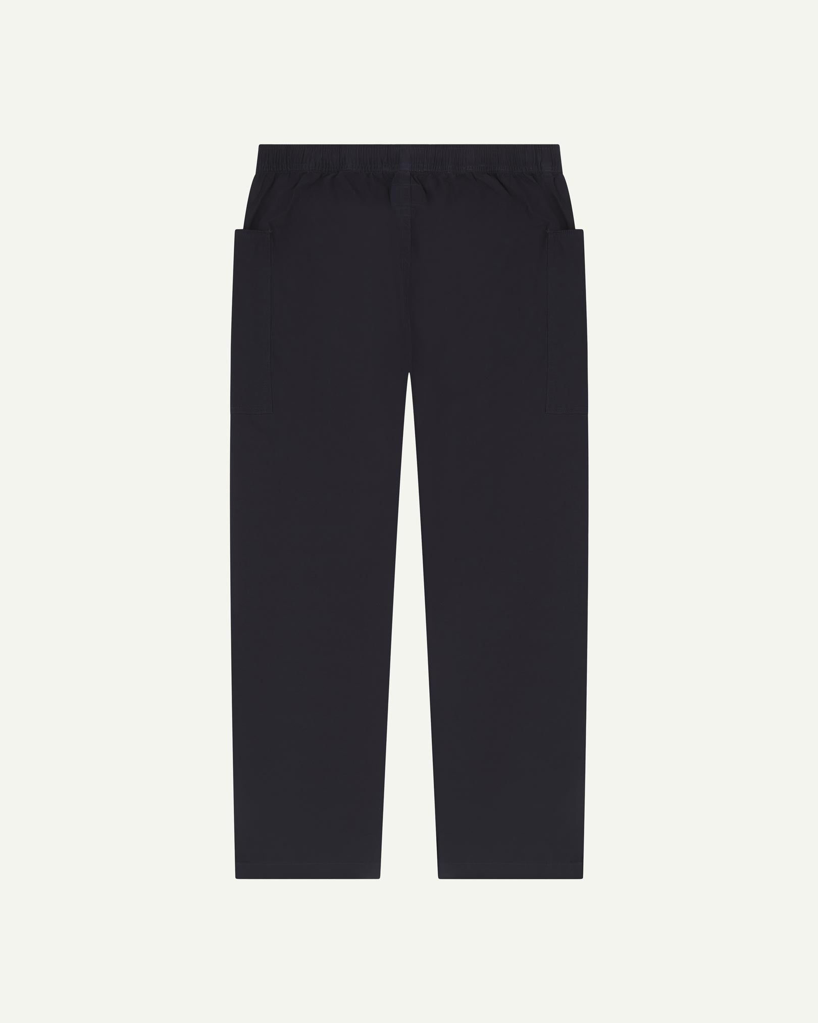 Full length back flat shot of midnight blue green lightweight cotton 5011 trousers showing the deep pockets and the relaxed, tapered fit on the leg.