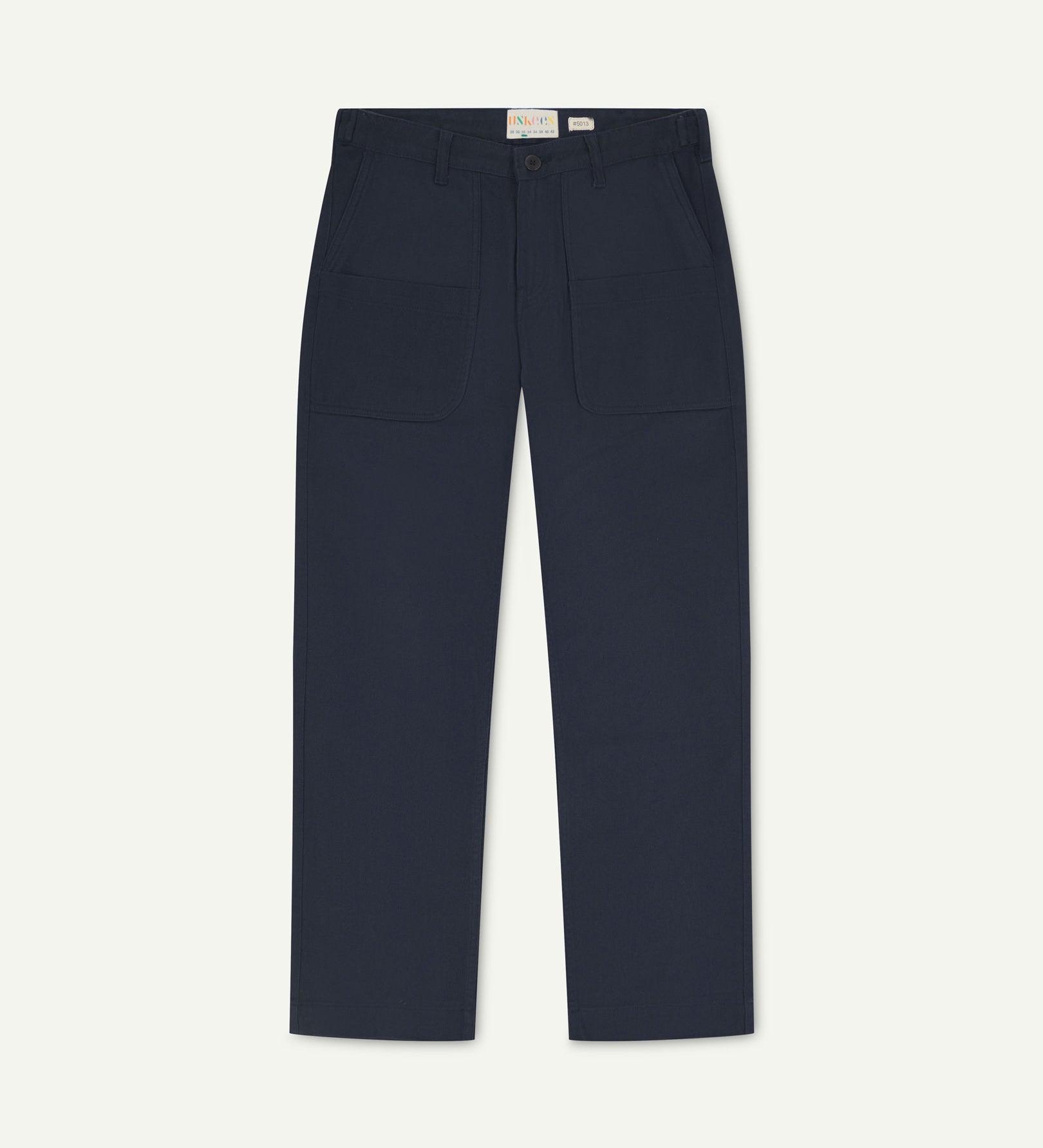 Front flat view of 5013 Uskees drill straight leg pants in dark blue, with focus on front pockets, layered pockets, belt loops and Uskees branding label.
