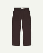 Front flat view of 5013 Uskees drill straight leg pants in brown-maroon, with focus on front pockets, layered pockets, belt loops and Uskees branding label.