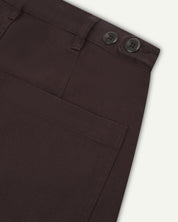 Flat shot back view of uskees dark plum drill trousers showing back pocket and waistband detail