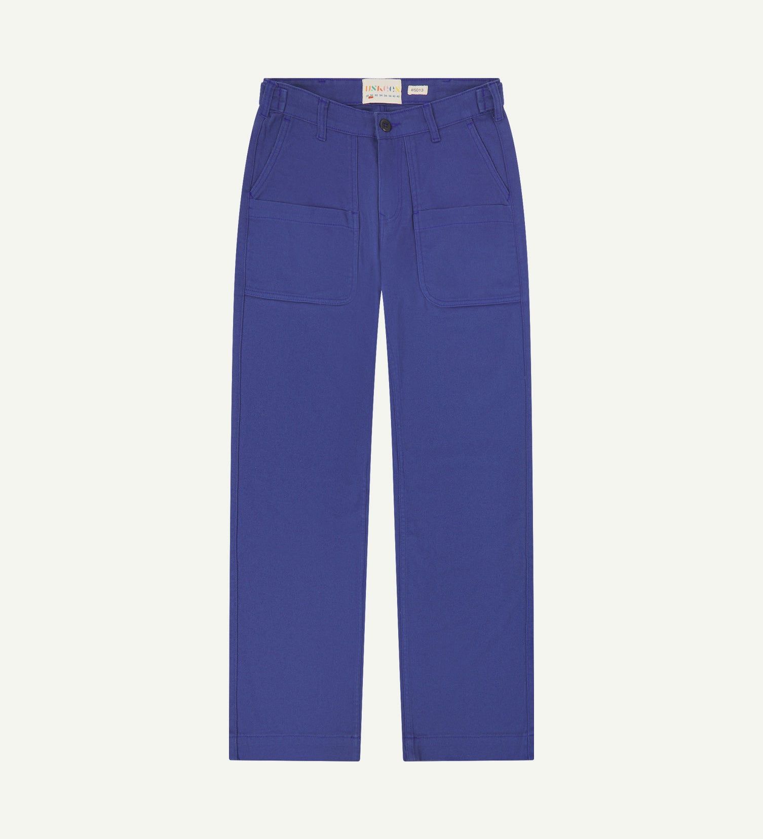 Front flat view of 5013 Uskees drill straight leg pants in ultra blue,with focus on front pockets, layered pockets, belt loops and Uskees branding label.