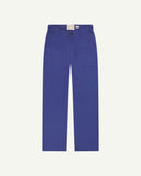 Front flat view of 5013 Uskees drill straight leg pants in ultra blue,with focus on front pockets, layered pockets, belt loops and Uskees branding label.
