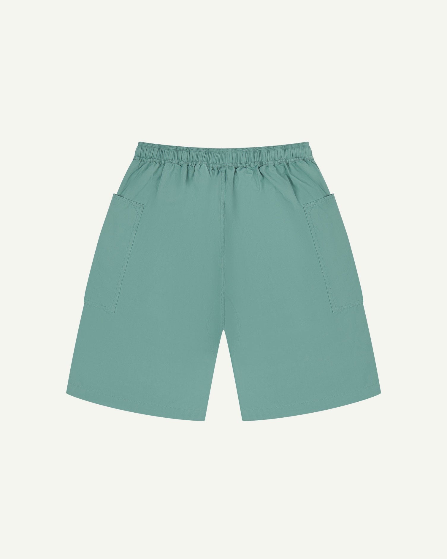 Back flat view of eucalyptus-green organic cotton #5015 lightweight cotton shorts by Uskees. Clear view of lightweight elasticated waist and pockets.