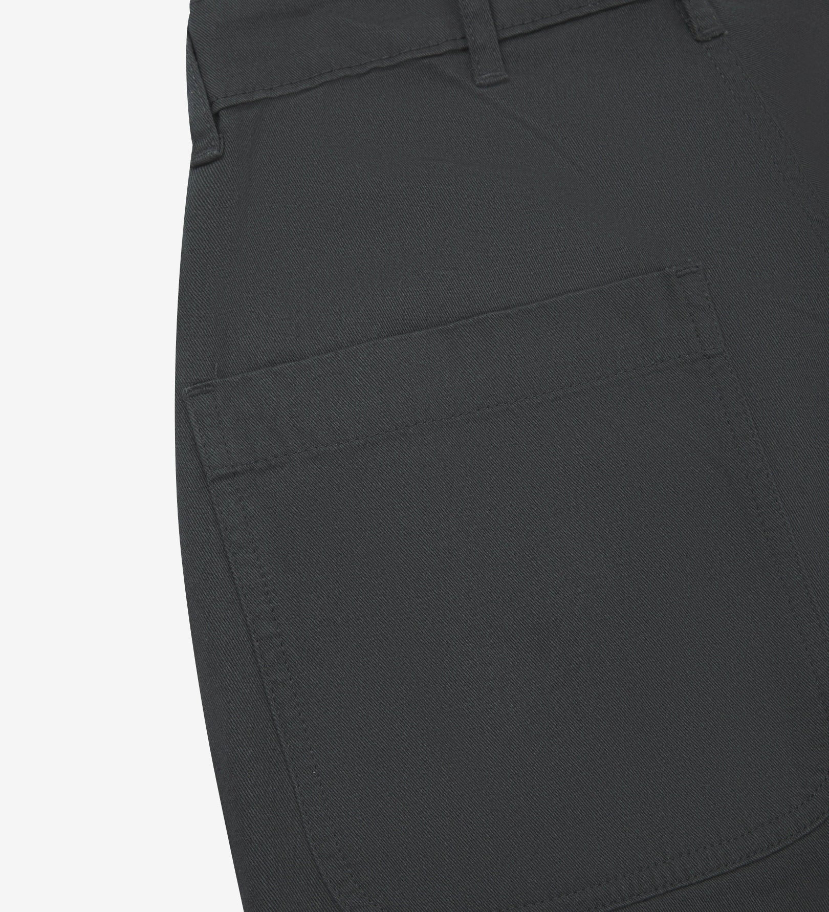 Close-up reverse view of Uskees charcoal grey twill pants with focus on left rear patch pocket and belt loops.