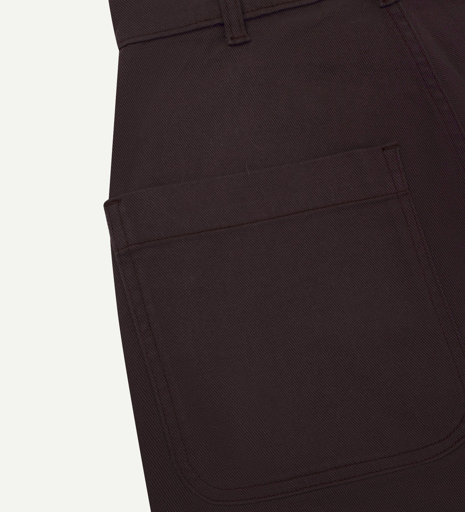 Close-up reverse view of Uskees 'dark plum' heavyweight drill work pants with focus on left rear pocket and belt loops.