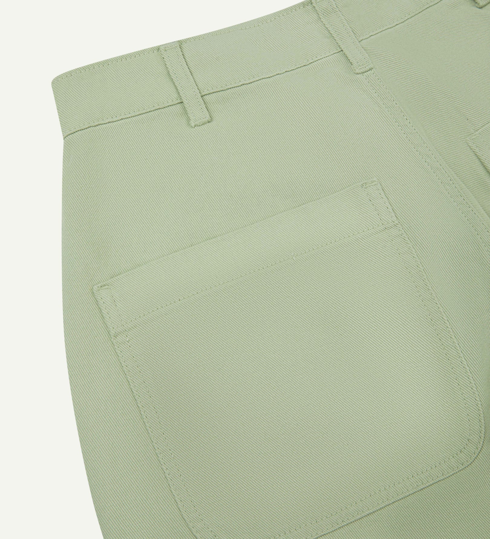 Close-up reverse view of Uskees silver-grey heavyweight drill work pants with focus on left rear pocket and belt loops.