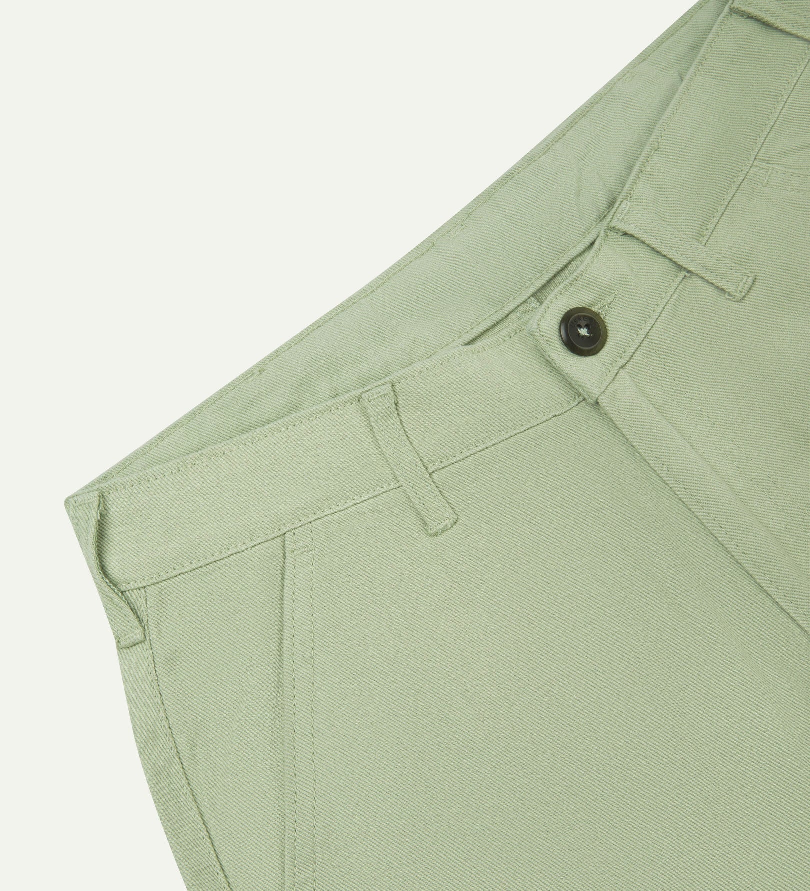 Close-up front view of the left-front pocket detail and belt loops of the silver-grey heavyweight drill pants.