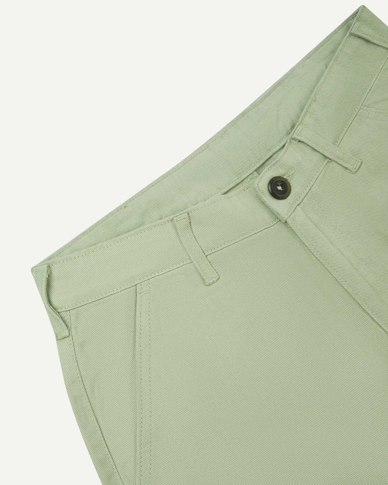 Close-up front view of the left-front pocket detail and belt loops of the silver-grey heavyweight drill pants.