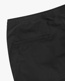 Close up view of the jetted back pocket and the waistband of the black ripstop pants from Uskees.