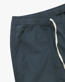 Close up front view of the front welt pocket, elasticated waist and tie of the blueberry ripstop pants from Uskees.
