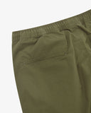 Close up view of the jetted back pocket and the waistband of the ivy green ripstop pants from Uskees.