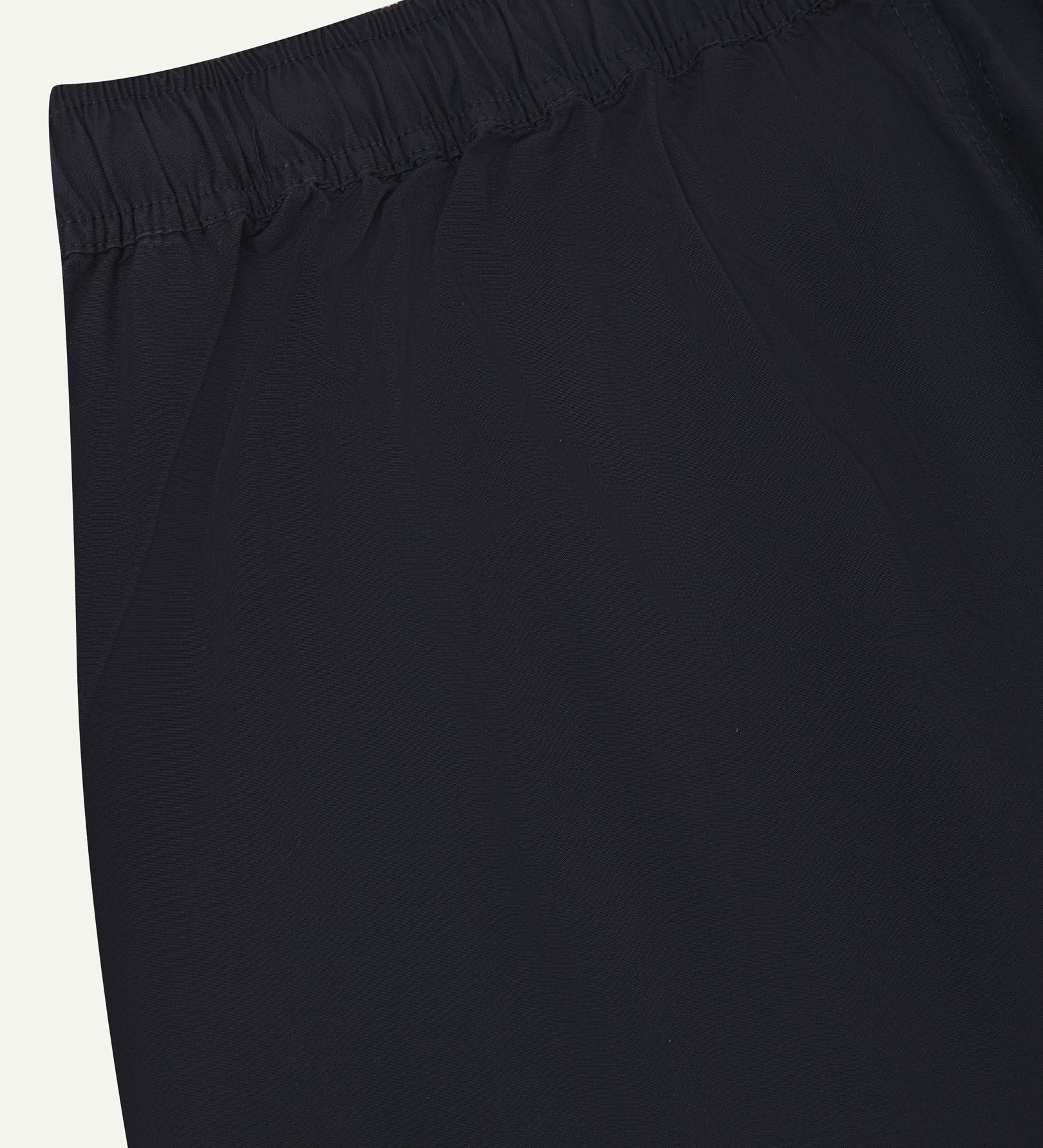 Back close-up shot of Uskees 5020 midnight blue lightweight utility pants showing elasticated waist.
