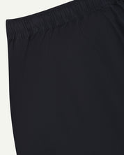 Back close-up shot of Uskees 5020 midnight blue lightweight utility pants showing elasticated waist.