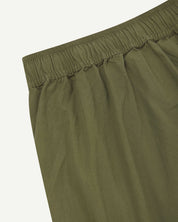 Close up detailed shot of Uskees 5020 olive lightweight utility pants showing elasticated waist