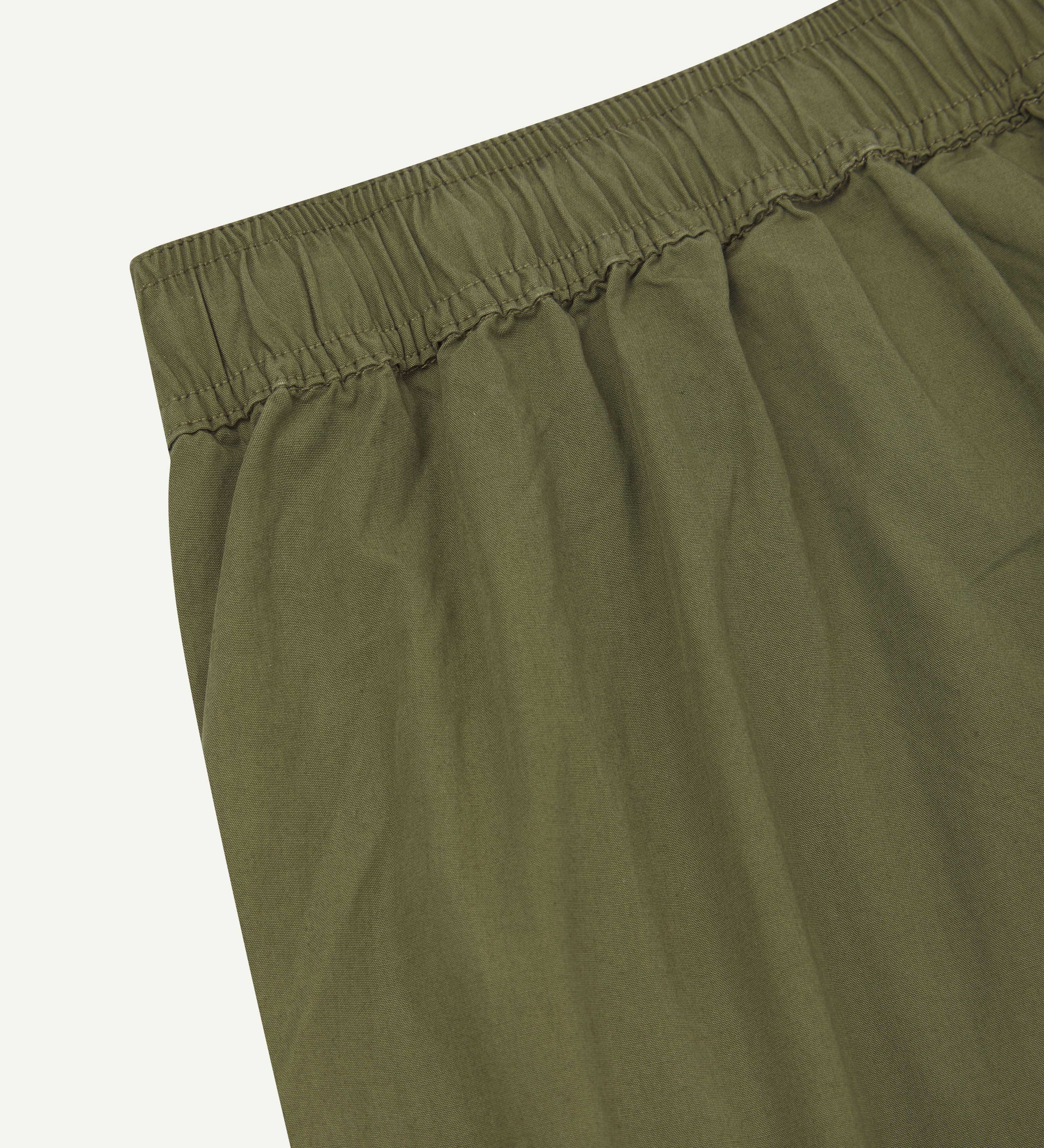 Close up detailed shot of Uskees 5020 olive lightweight utility pants showing elasticated waist