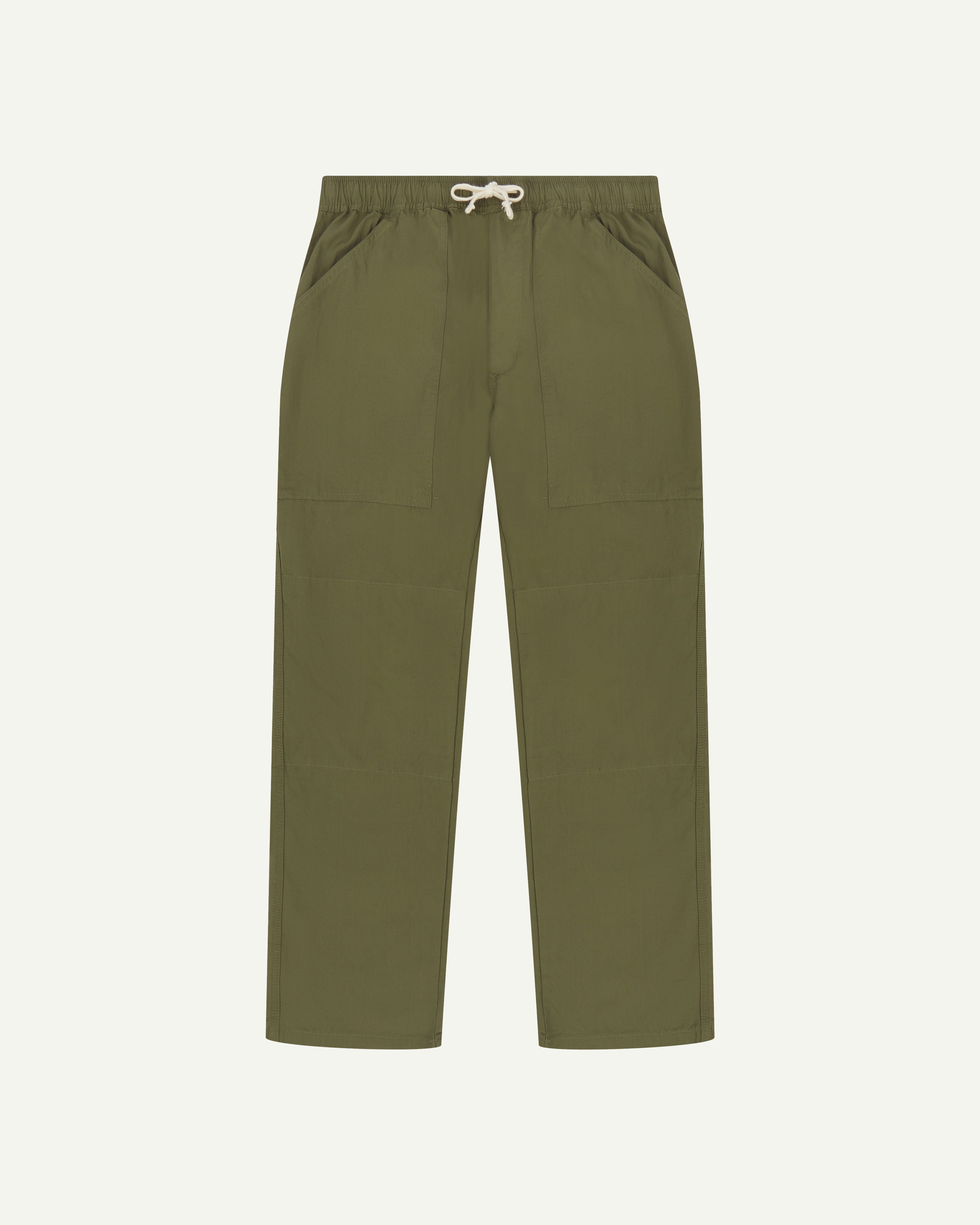 Flat front shot of the Uskees 5020 olive lightweight utility pants showing drawstring waist and large front pockets