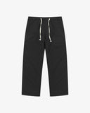 Uskees black ripstop pants with white drawstrings on a white background