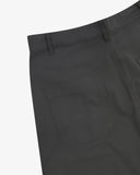 Close-up reverse view of Uskees charcoal grey work pants with focus on left rear pocket, belt loops and cotton twill material.