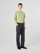 Full-length view modelling 5021 Uskees men's organic twill charcoal grey painter pants paired with Uskees t-shirt.
