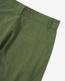Close-up reverse view of Uskees coriander-green work pants with focus on right rear pocket, belt loops and cotton twill material.