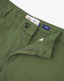 Close-up front view of the organic twill coriander-green 'painter' trousers showing belt loops, zip fly, branding label and Corozo button.