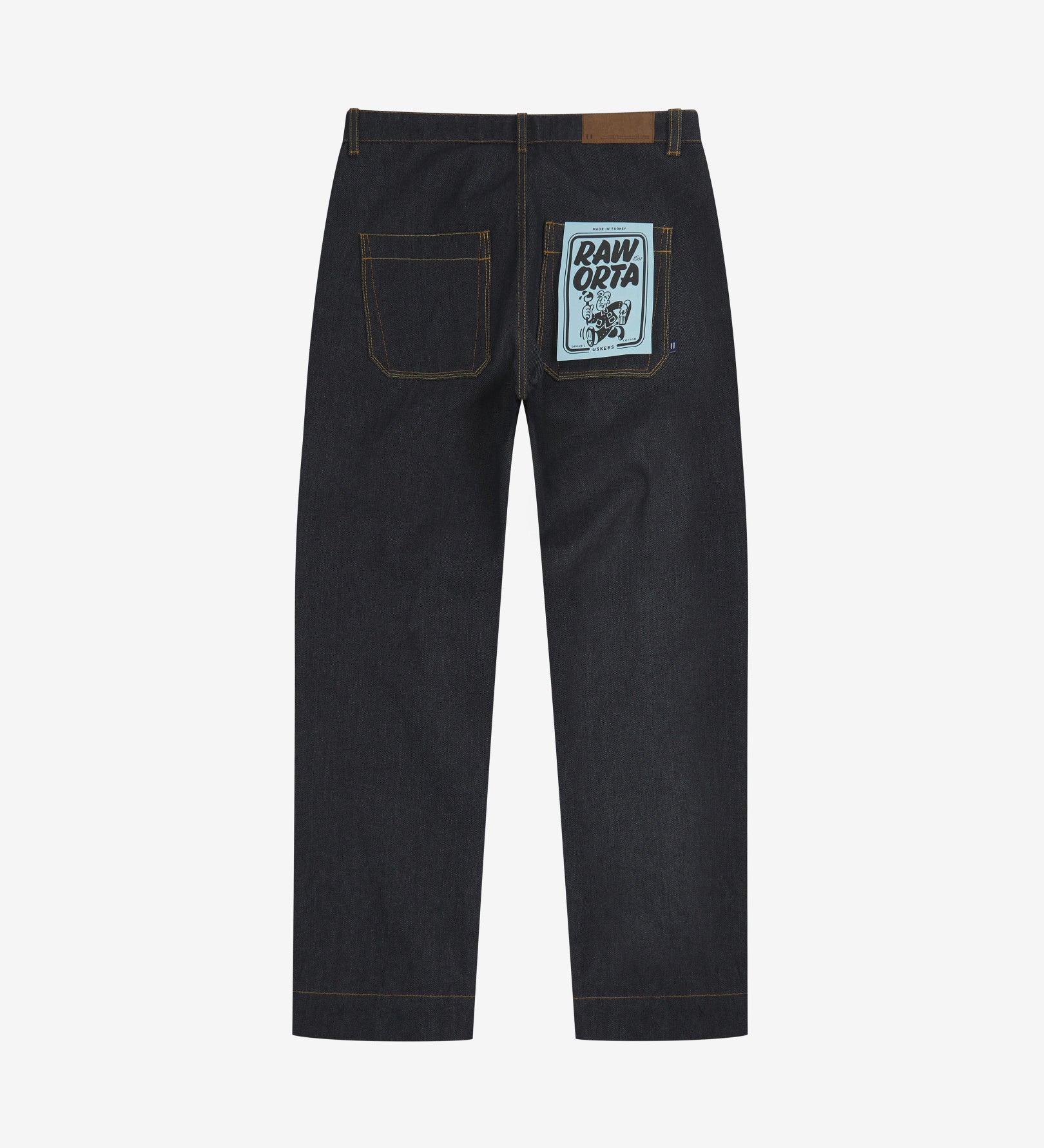 Full-length back view of Uskees 5021 raw orta denim workwear pants in dark indigo showing belt loops, back pockets with 'Raw Orta' cardboard pocket plaster.