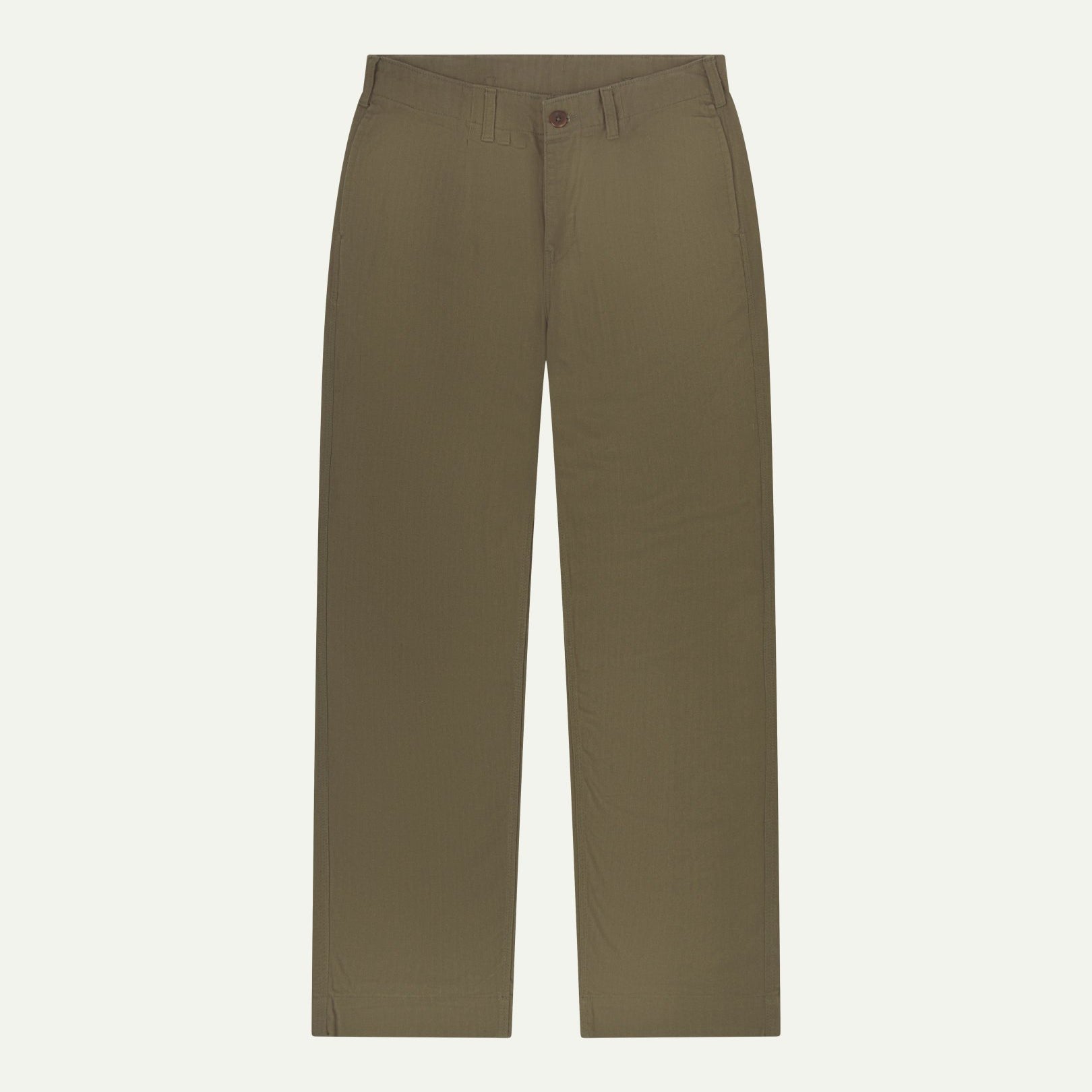 Front flat view of Uskees barrel leg pants in dark taupe. Showing Corozo button fastening, baggy fit with tapered cuff.