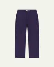 Front flat view of Uskees barrel leg pants in deep indigo. Showing Corozo button fastening, baggy fit with tapered cuff.