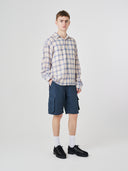 Full-length front view of male model wearing 5023 men's ripstop cargo shorts in blueberry, paired with casual check shirt.
