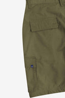 Close-up back flat view of 5023 ripstop cargo shorts in ivy green. Focus on left flap pocket and left cargo pocket.