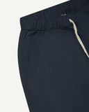 Close up front view of the front welt pocket, elasticated waist and tie of the blueberry ripstop shorts from Uskees.