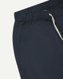 Close-up, angled front view of blueberry 5024 men's ripstop utility shorts by Uskees. Clear view of a front pocket, white drawstring and the weave of the ripstop fabric.