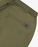 Close up back view of the jetted back pocket, elasticated waist and small Uskees tab label of the ivy green ripstop shorts.