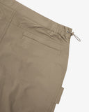 Close up shot of Uskees herb green ripstop hike trousers for men showing the adjustable waistband and pocket detail.