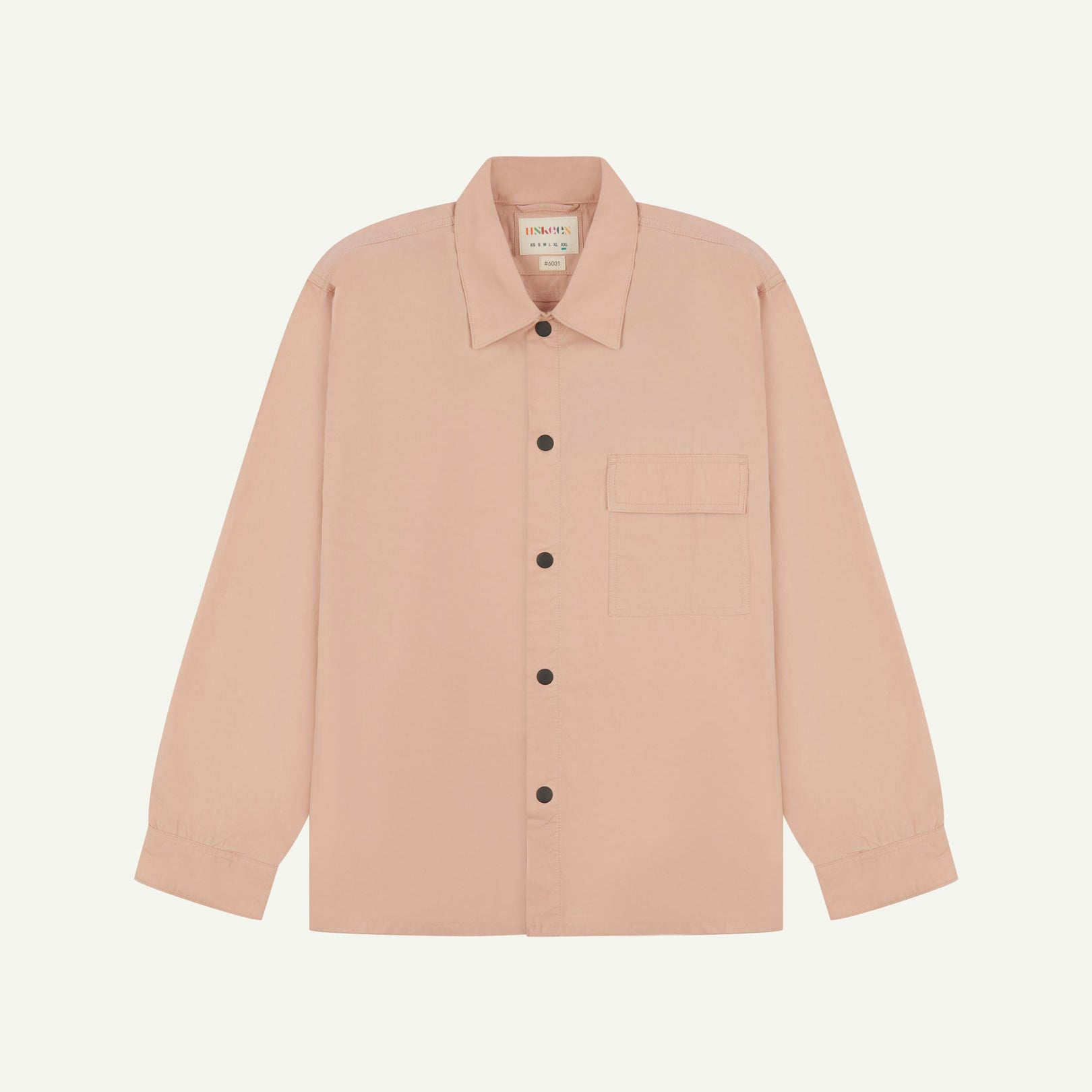 Front flat view of dusty pink, lightweight overshirt. Clear view of the press studs, breast pocket and Uskees branding label.
