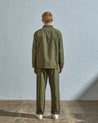 Full-length rear view of model wearing #6001, olive over shirt showing reinforced elbows.