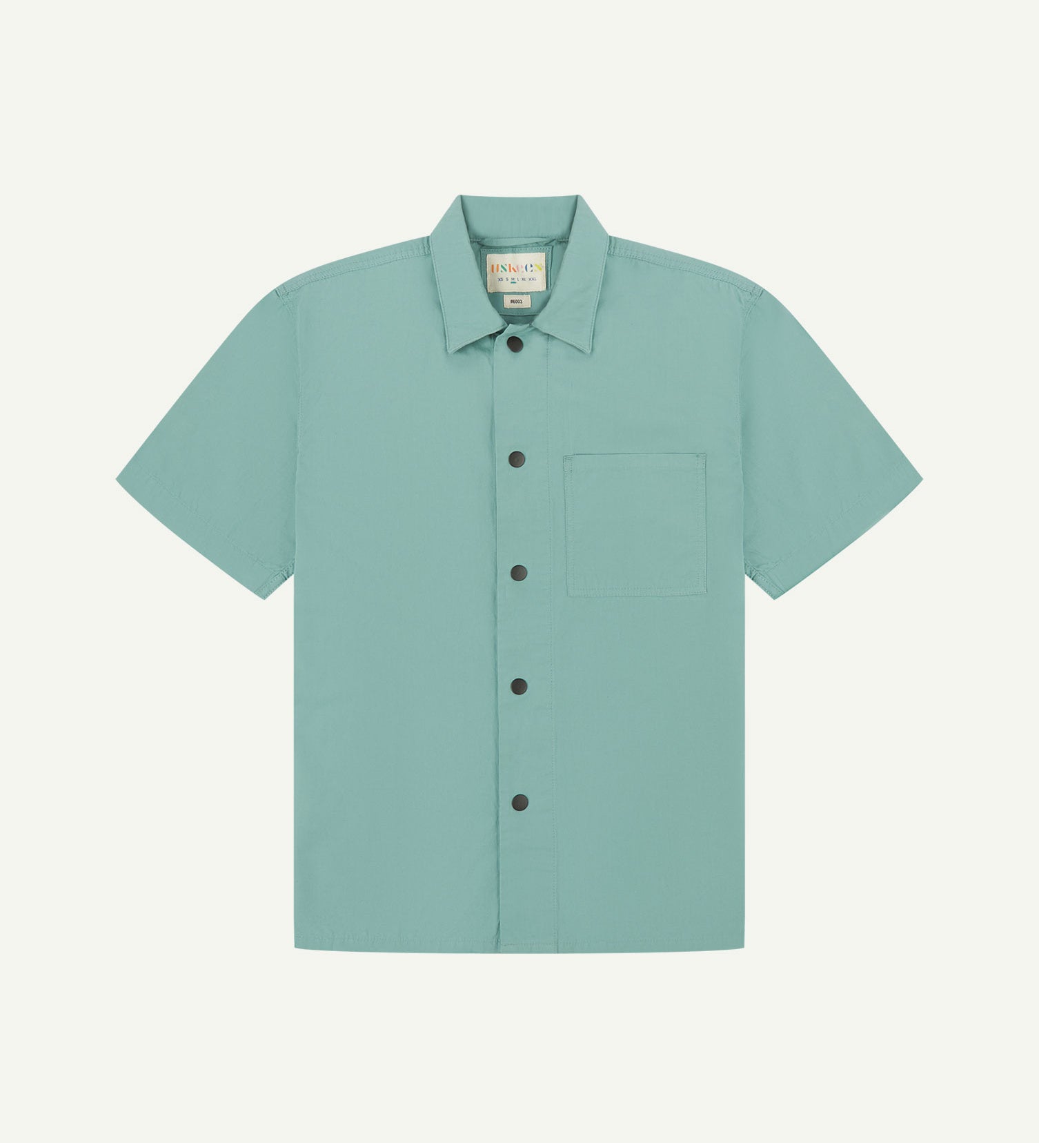 Front flat view of eucalyptus-green buttoned organic cotton lightweight short sleeve shirt from Uskees.