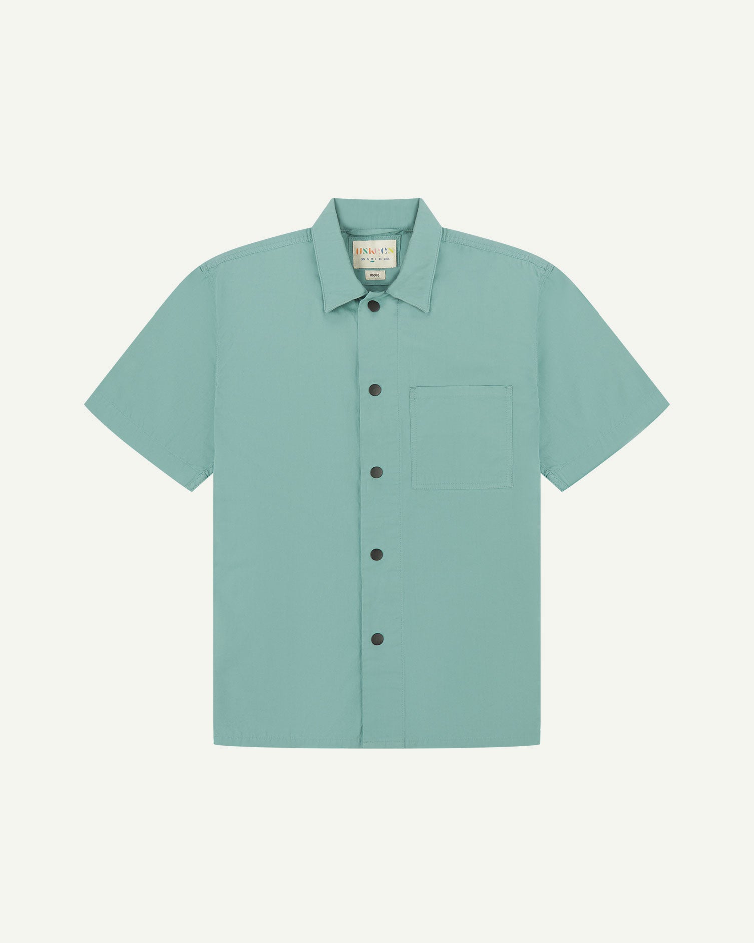 Front flat view of eucalyptus-green buttoned organic cotton lightweight short sleeve shirt from Uskees.