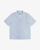 Front flat shot of Uskees blue, gold and white striped cuban shirt for men. Clear view of corozo buttons, chest pocket and Uskees branding label.