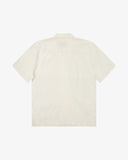 Back view flat shot of Uskees cream linen blend short-sleeve Cuban shirt for men.