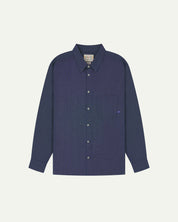 Flat front view of mid blue organic chambray Oxford shirt from Uskees. Clearly showing loose fit and 8-button front.