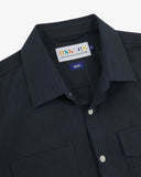Close-up and angled front view of the 6007 Tasker shirt in dark blue showing the branding label, collar, hanging loop and buttons.