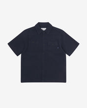 Front flat view of Uskees Tasker buttoned short sleeve shirt with deep blue organic cotton waffle fabric.