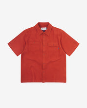 Front flat view of Uskees Tasker buttoned short sleeve shirt with rust-red organic cotton waffle fabric.