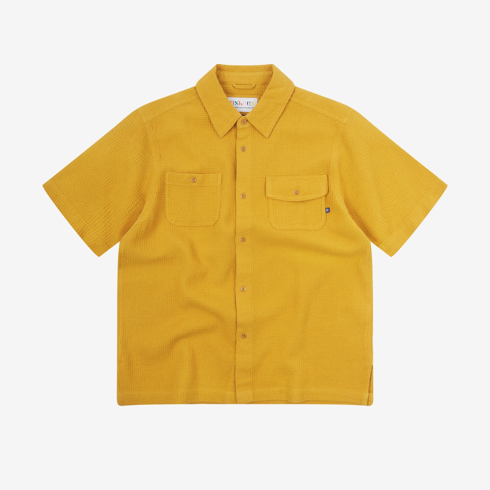 Front flat view of Uskees Tasker buttoned short sleeve shirt with yellow organic cotton waffle fabric.