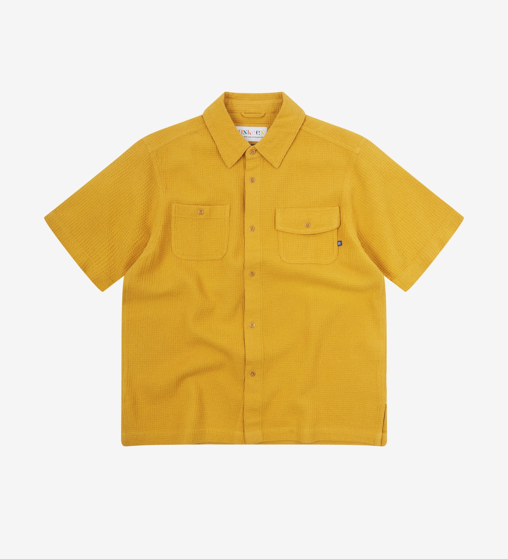 Front flat view of Uskees Tasker buttoned short sleeve shirt with yellow organic cotton waffle fabric.