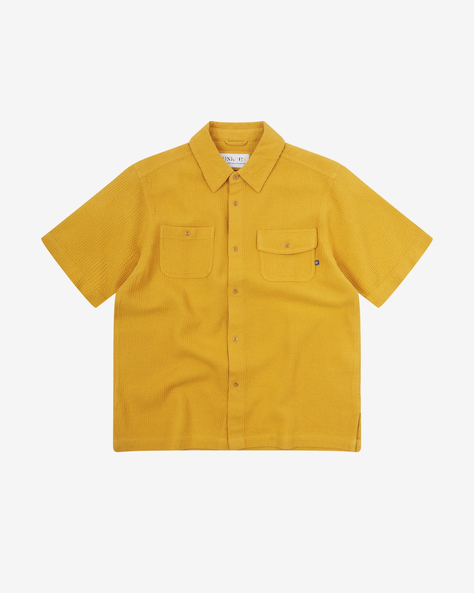 Front flat view of Uskees Tasker buttoned short sleeve shirt with yellow organic cotton waffle fabric.