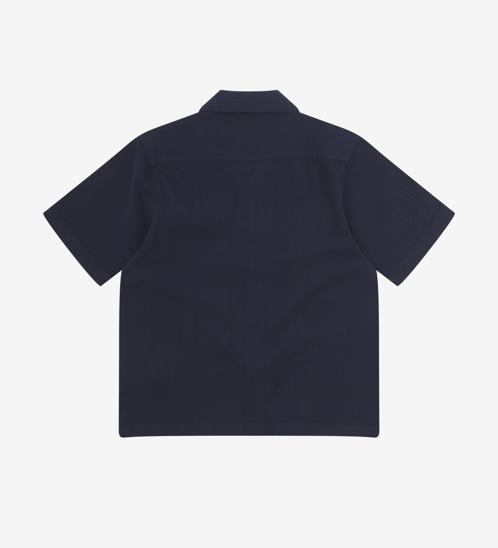 Reverse flat view of deep blue organic cotton waffle fabric short sleeve shirt from Uskees showing loose, relaxed style.